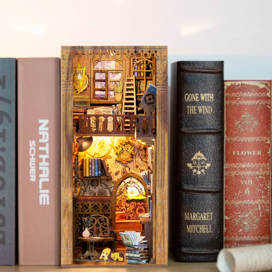 The Hands Craft DIY Book Nook Kit: Eternal Bookstore with Dust Cover lets you create a cozy miniature library diorama, complete with books, ladder, and warm lights—a magical literary gift for any book lover's shelf.