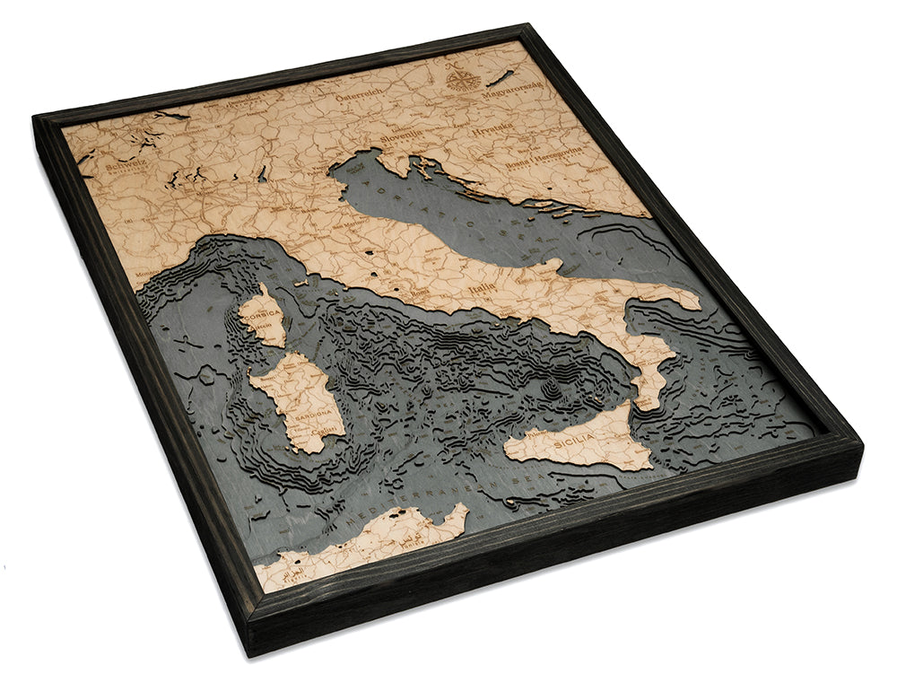 The WoodChart Italy 24.5" x 31" Grey Frame features a layered wooden map with topographic details of Italy and its surroundings, labeled place names, islands, and varying ocean depths in a stylish grey frame.