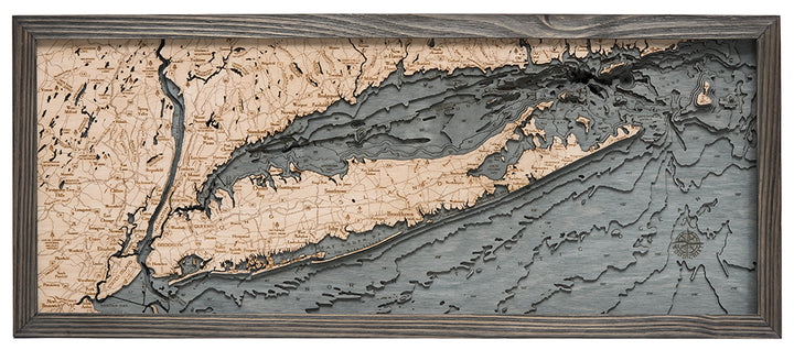 WoodChart’s Long Island Sound 13.5" x 31" wooden map features engraved labels, a compass rose, and contrasting wood tones to highlight land and water, all set in a sleek grey rectangular frame.