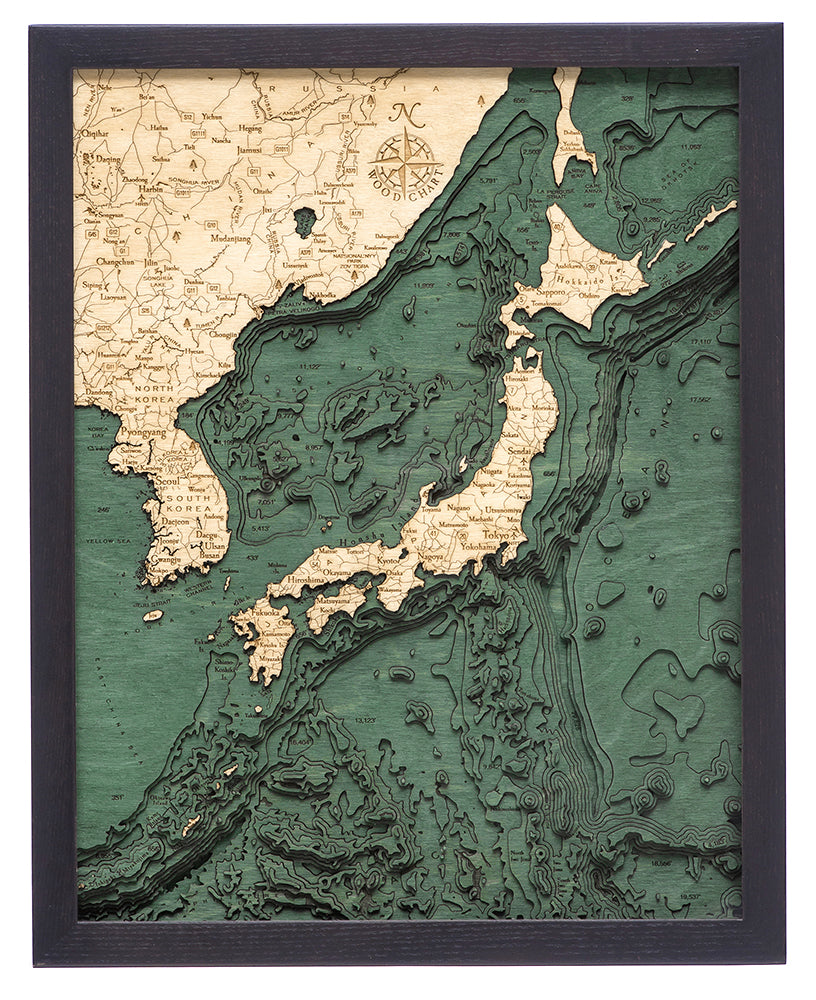 The WoodChart Japan Korea 16" x 20" Black Frame features a vintage-style, layered map detailing Japan, eastern China, and Russia with green and tan topography and ocean depths.