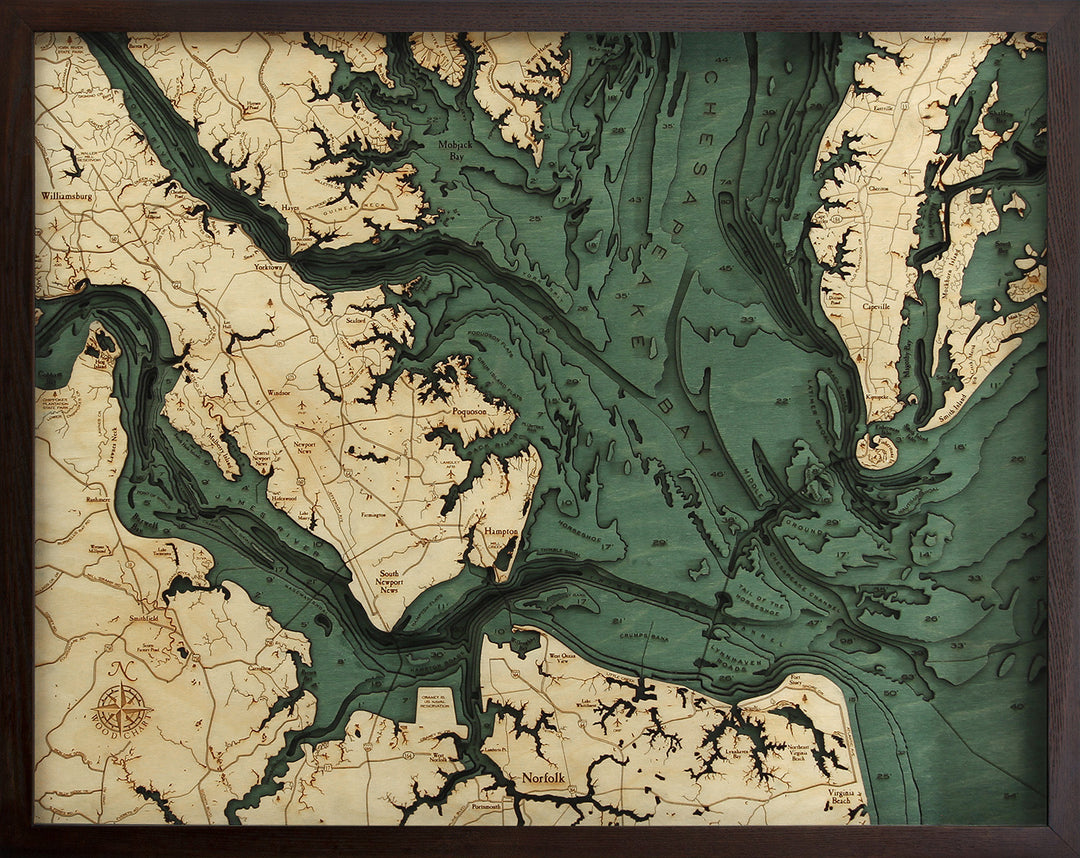 WoodChart's Norfolk VA 24.5 x 31 Black Frame is a vintage-style map of the Chesapeake Bay area, featuring shaded water, topographical markings, and highlights of cities like Norfolk and Williamsburg.