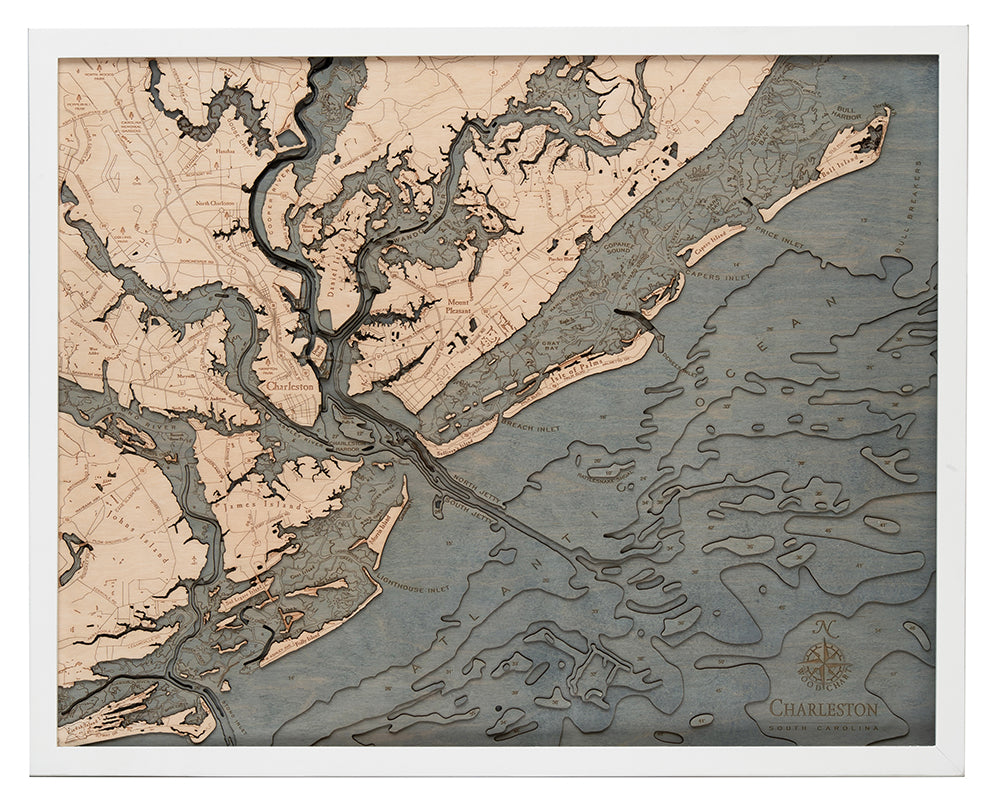 The WoodChart CharlstonSC 24.5 x 31 White Frame features a labeled topographical map of Charleston, South Carolina, with rivers, marshes, and coastline in beige and blue-gray tones plus a compass rose in the lower right corner.