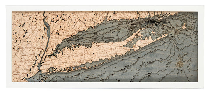 WoodChart’s Long Island Sound 13.5" x 31" White Frame features layered cutouts in beige and blue-gray, displaying topographic land and ocean depth contours of Long Island, coastal New York, and parts of Connecticut.