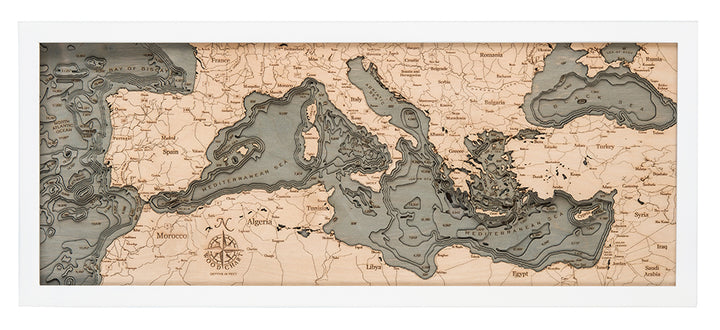 WoodChart’s Mediterranean Sea 13.5" x 31" map features laser-cut wood detailing of Europe, Africa, and the Middle East in a sleek rectangular white frame, highlighting land and water contours with precision.