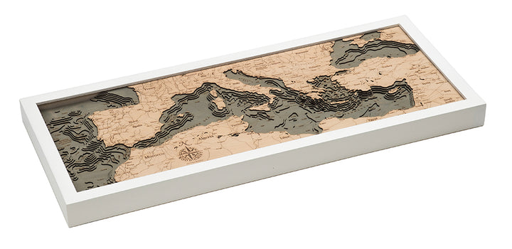 The WoodChart Mediterranean Sea 13.5" x 31" features a layered wooden map with varying depths illustrating land and water, elegantly set in a white rectangular frame.