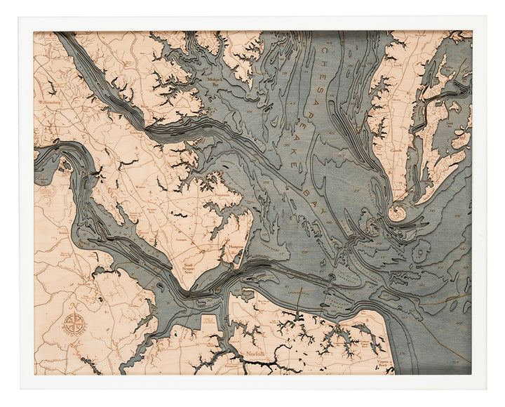 WoodChart’s Norfolk VA 24.5 x 31 White Frame features a detailed vintage-style map of the Chesapeake Bay area, with labeled waterways, islands, and land features in blue and tan tones plus a compass rose in the lower left corner.