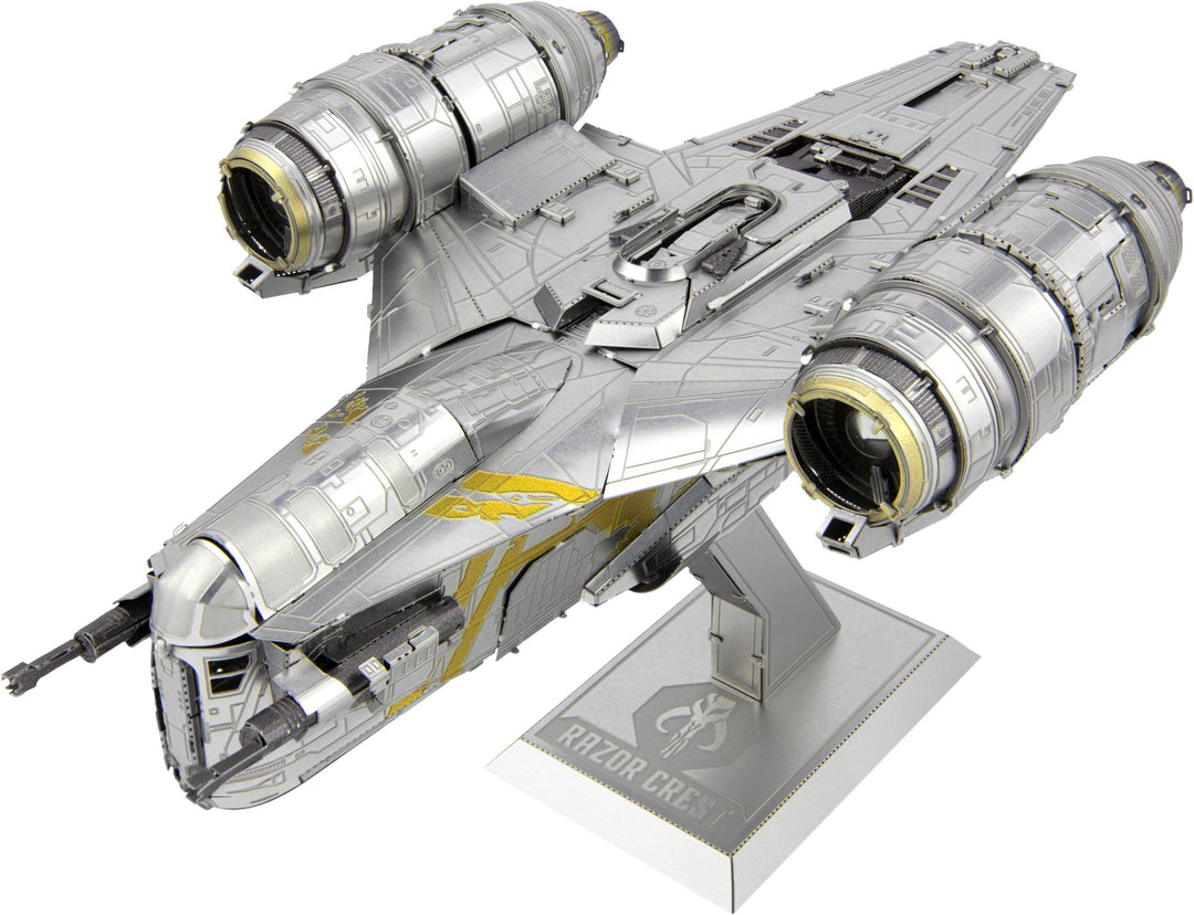 The Metal Earth Mandalorian Razor Crest Star Wars Premium DIY kit features a detailed model with two large engines, silver and gold metallic detailing, and is displayed on a stand labeled "Razor Crest.