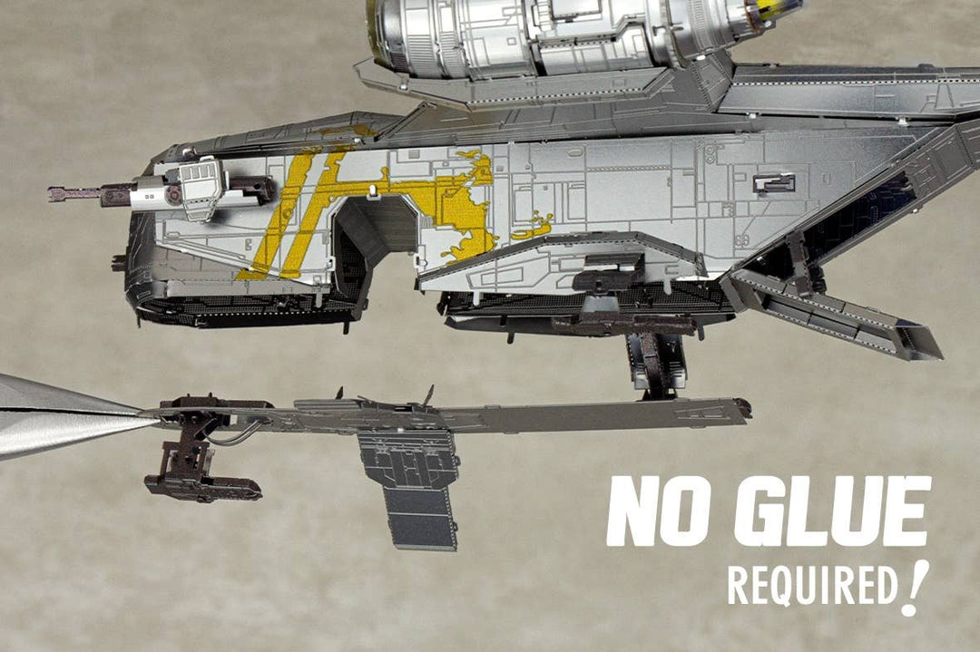 A close-up of the Mandalorian Razor Crest Star Wars Premium Metal Earth DIY kit from Metal Earth being assembled with tweezers. White text says, "NO GLUE REQUIRED!" Perfect for Star Wars model enthusiasts.