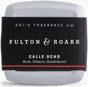 Fulton & Roark Calle Ocho .2oz is a silver tin of solid fragrance featuring “Rum, Tobacco, Sandalwood” notes inspired by Miami’s Little Havana.