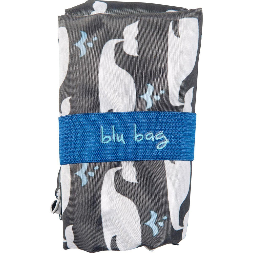 The Whales Reusable Bag by zzzRockFlowerPaper, featuring an ocean-inspired print of white and black whales and secured with a blue "blu bag" elastic band, supports Ocean Conservancy efforts.