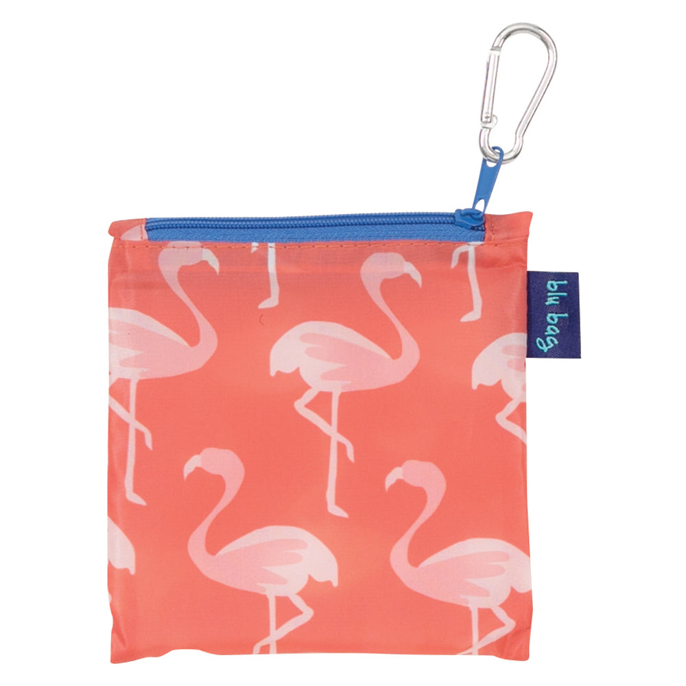 The Desert Flamingo Reusable Bag by zzzRockFlowerPaper is an eco-friendly shopping bag featuring a charming flamingo pattern on a coral background. It is equipped with a blue zipper and a metallic carabiner clip for effortless carrying, offering both style and practicality.