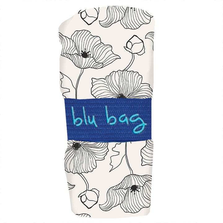 Introducing the Poppy Reusable Bag by zzzRockFlowerPaper: This eco-friendly shopping bag features a stylish black and white floral design with a chic line drawing, conveniently rolled up and secured with a blue fabric band proudly labeled "blu bag." Ideal for those committed to sustainability.