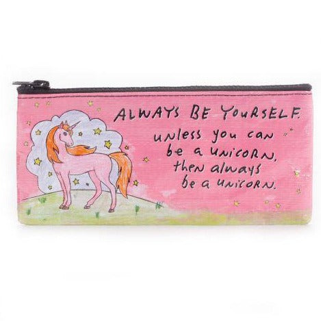 The "Be a Unicorn Pencil Case" by Blue Q is a rectangular, pink zippered pouch crafted from recycled materials. It prominently features a whimsical drawing of a unicorn with a rainbow mane and tail. Accompanying the unicorn is an inspirational message that reads, "Always be yourself unless you can be a unicorn, then always be a unicorn." The background of the design is adorned with small stars and a cloud.