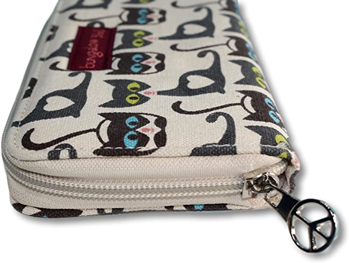The Bungalow 360 Zipper Wallet Cat is a rectangular, 100% vegan wallet made of natural cotton canvas. It features a charming design with black and white cartoon cats with colorful eyes on beige fabric. The interior card slots ensure organization, while the silver peace sign zipper pull adds an extra touch of charm.