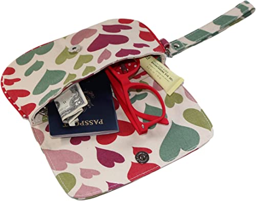The Large Wristlet Hearts by Bungalow 360 is a cotton canvas pouch with a heart pattern and a metal clasp, perfect for holding a pair of red glasses, a small Bible, a passport, and a dollar bill.