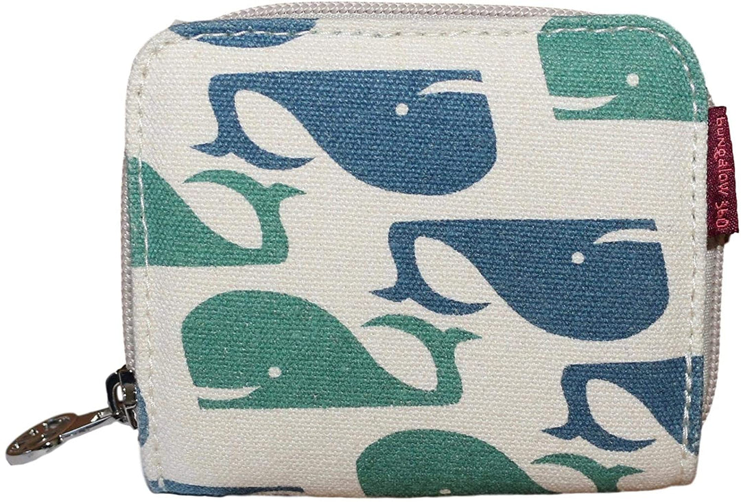The Bungalow 360 Bill Fold Wallet Whale is a square fabric wallet with a zipper, showcasing green and blue whales on a cream background, plus a small red tag with white text supporting animal causes.
