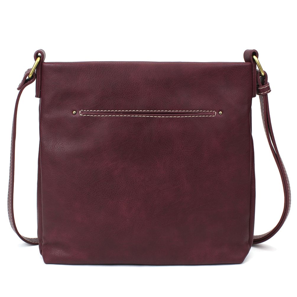 Introducing the Lasercut Crossbody DF in plum by Chala, a faux leather crossbody bag with a minimalist design. This bag offers a sleek, rectangular shape, a slim front pocket accented with white stitching, and adjustable straps featuring elegant brass hardware.