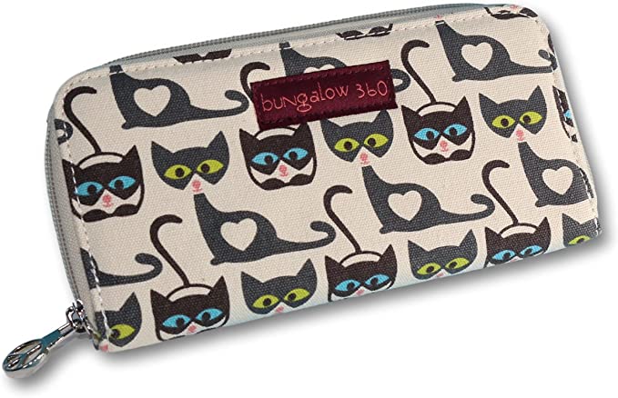 Introducing the Zipper Wallet Cat, an eco-friendly accessory by Bungalow 360. This chic canvas wallet is crafted from natural cotton and adorned with a charming black and white cat pattern, each sporting blue or green eyes and a heart-shaped mark on its belly. The 100% vegan wallet includes interior card slots and features a small red label bearing the "bungalow 360" brand name.