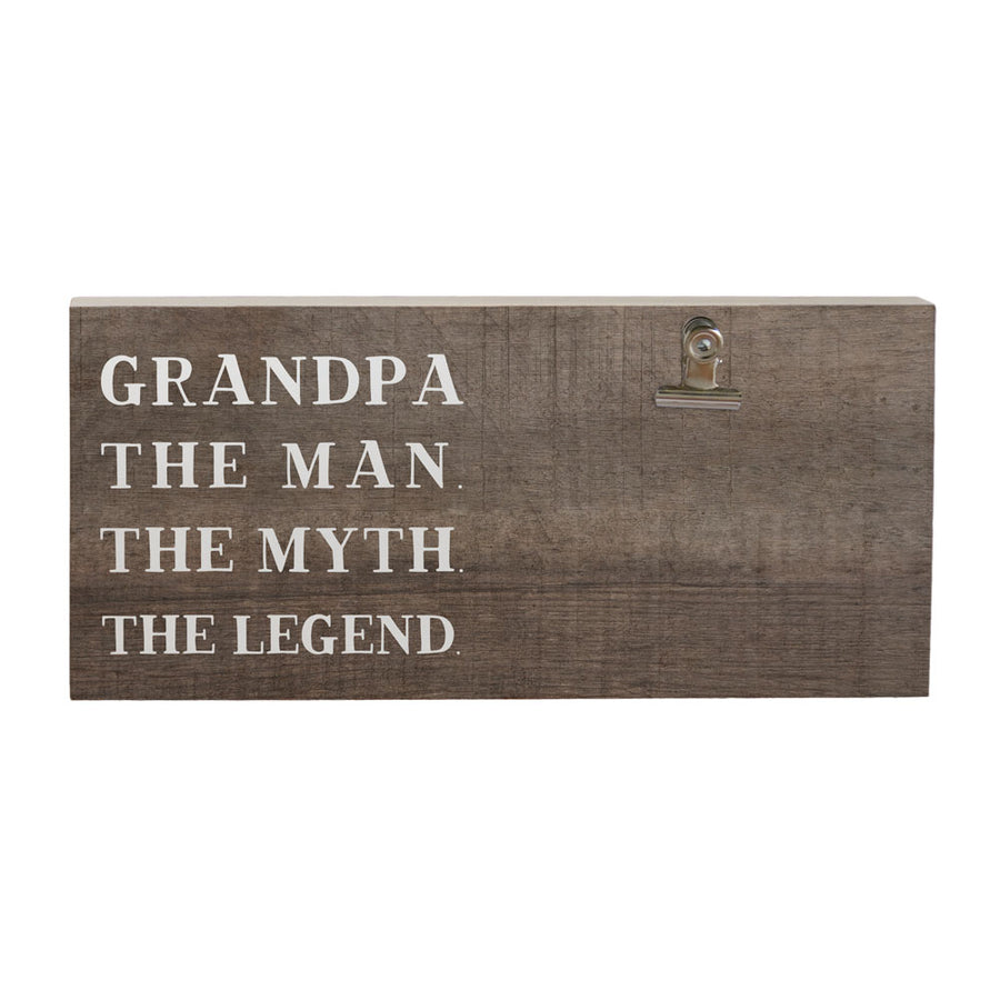 The "Grandpa The Man Photo" by SincereSurroundings is a charming handcrafted wooden plaque featuring white text that reads "GRANDPA THE MAN. THE MYTH. THE LEGEND." It includes a metal photo clipboard on the right side, ideal for displaying cherished memories from Rock Rapids, IA and beyond.