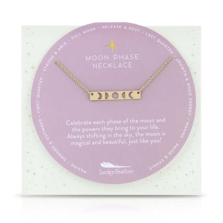Image of a LuckyFeather Moon Phase Necklace Gold with a 14k gold-dipped brass chain and rectangular pendant depicting moon phases. Perfect for astrology fans, it's presented on a card elaborating each phase's impact on personal growth and energy.