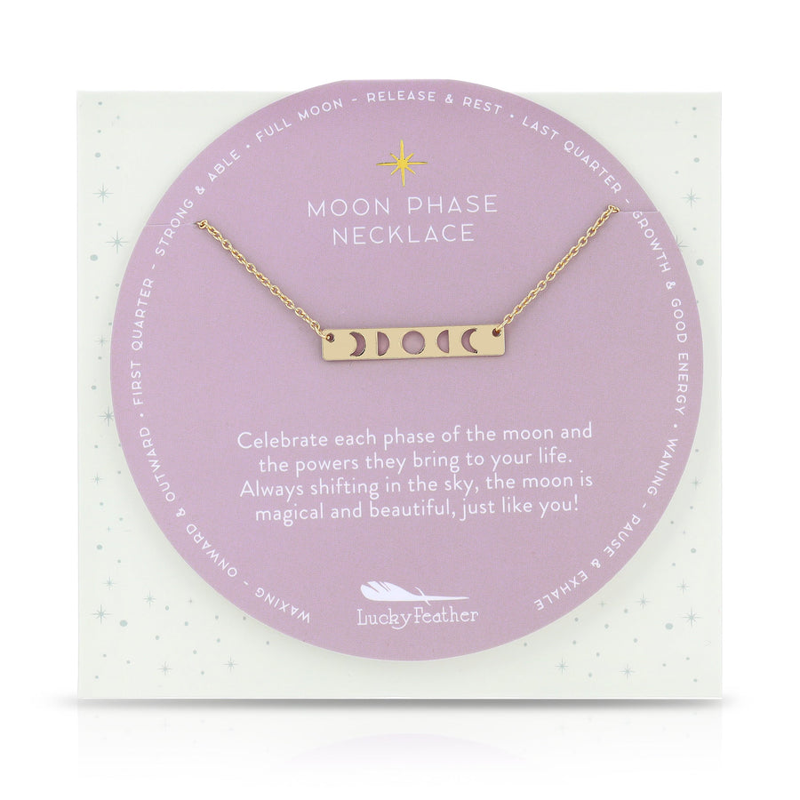 Image of a LuckyFeather Moon Phase Necklace Gold with a 14k gold-dipped brass chain and rectangular pendant depicting moon phases. Perfect for astrology fans, it's presented on a card elaborating each phase's impact on personal growth and energy.