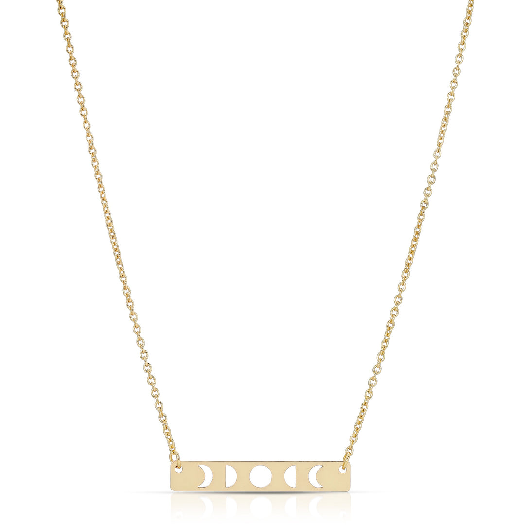 The LuckyFeather Moon Phase Necklace Gold features a 14k gold-dipped brass rectangular pendant with moon phase cut-out designs, perfect for astrology fans, and is elegantly suspended on a delicate chain.