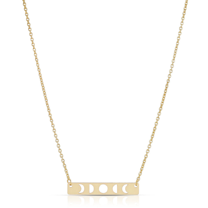 The LuckyFeather Moon Phase Necklace Gold features a 14k gold-dipped brass rectangular pendant with moon phase cut-out designs, perfect for astrology fans, and is elegantly suspended on a delicate chain.