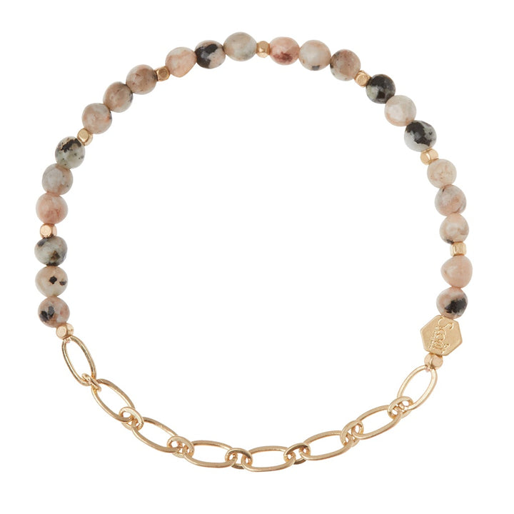 The Chain Bracelet Rhodonite/Gold by Scout Jewelry features round multicolored semi-precious gemstone beads in gray, pink, and black with gold oval paperclip chain links and a small engraved charm.
