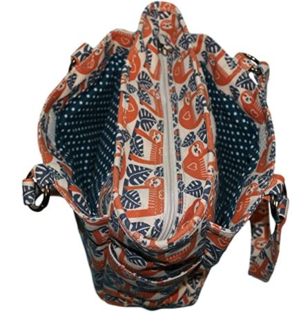 A top-view of Bungalow 360's Pocket Bag Sloth reveals a whimsical animal theme with orange sloths and blue leaves. The vegan design inside features blue and white polka dots. It includes two handles with a zipper closure, highlighted by a signature peace sign zipper-pull.