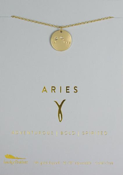 A LuckyFeather Zodiac Necklace Aries featuring a circular pendant with the Aries constellation is showcased on a light background. The word "ARIES" is elegantly inscribed in gold letters above the Aries symbol, and beneath it are the words "ADVENTUROUS | BOLD | SPIRITED.
