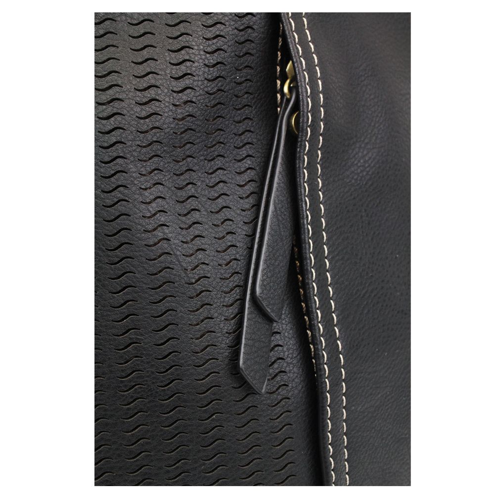 Close-up image of the Lasercut Crossbody DF Black by Chala, showcasing its textured wave patterns on the black faux leather surface and a partially visible gold zipper. White stitching lines along the edge adjacent to the zipper enhance its design. A prominent black leather zipper pull is centered for easy access.
