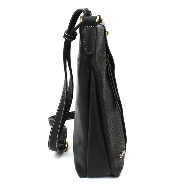 Side view of the Chala Lasercut Crossbody DF Black faux leather shoulder bag, showcasing its gold hardware and adjustable straps. The bag features a textured design with intricate laser cut patterns and white stitching along the edges for added detail.